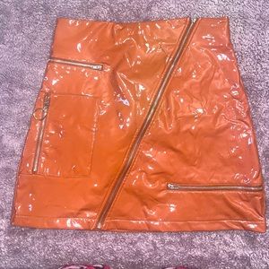 Peach color patent leather skirt